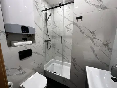 a bathroom with a shower and a toilet and a sink at Premium Apartment in Spiski Palace in Kraków