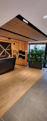 an empty room with potted plants in a building at Luxury Apartments, self check in 24 h & Free Parking in Kraków