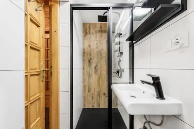 a bathroom with a sink and a shower at Chata pod 7 lipami in Jaworzna