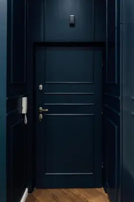 a blue door in a room with a wooden floor at CityPlace Apartment Starowiślna 43 in Kraków