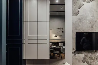 a living room with a white cabinet and a television at CityPlace Apartment Starowiślna 43 in Kraków