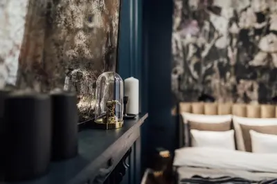 a room with a counter with a mirror and chairs at CityPlace Apartment Starowiślna 43 in Kraków