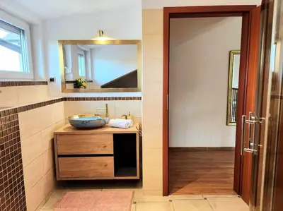 a dining room with a table and a mirror at Cozy Apartament Country 6persons close to airport in Kraków