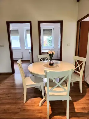 a bedroom with a bed with two towels on it at Cozy Apartament Country 6persons close to airport in Kraków
