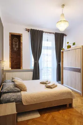 a living room with a couch and a table at Nice Place in Kraków