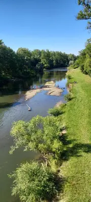 a river with a group of people swimming in it at Apartamenty Oświęcim klimatyzacja air-conditioned in Oświęcim