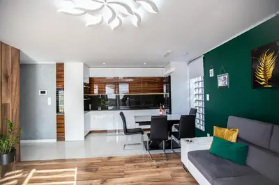 a living room with a couch and a table at Wlodarska 4a Apartament Premium in Kraków