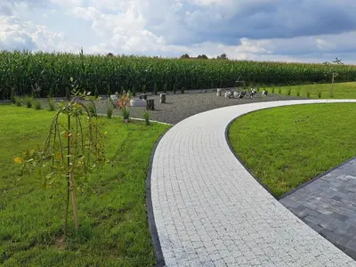 a walkway in a park with a corn maze at Jaśminowa Park in Zator