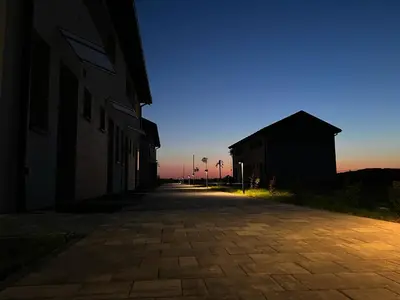 an empty street with a building on the side at Jaśminowa Park in Zator