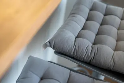 a close up of a couch with pillows at Verona House - Premium Apartment in Kraków