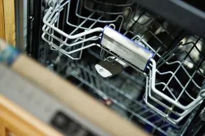 a dishwasher with a metal object in it at Apartament Thaddeus 48 z tarasem in Zator