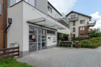 a building with a bench in front of it at Stawowa Apartment with Balcony & Parking Cracow by Noclegi Renters in Kraków