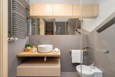 a bathroom with a sink and a toilet at Stawowa Apartment with Balcony & Parking Cracow by Noclegi Renters in Kraków