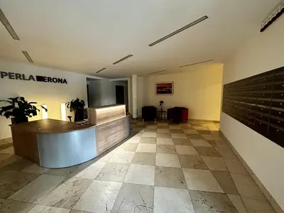 a lobby with a reception desk in a building at Tresor Pułaskiego Apartments in Kraków