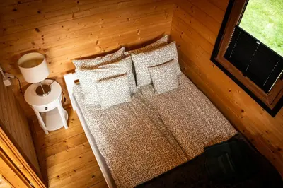 an overhead view of a bed in a cabin at Relax domki Zator in Zator