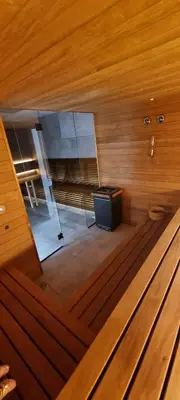 a view of a room with a tv in a sauna at Apartament Xavier II Kraków in Kraków
