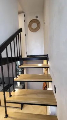 a staircase with wooden steps in a room at Old Town Apartment, Starowiślna in Kraków