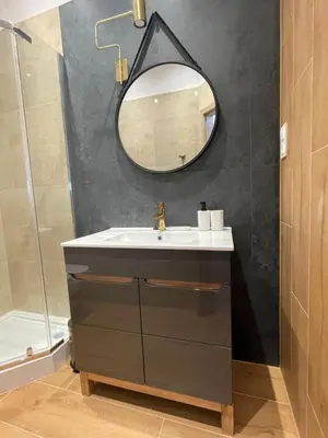a bathroom with a sink and a mirror at Aparthotel Cracow in Kraków
