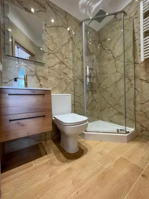 a bathroom with a toilet and a shower at Aparthotel Cracow in Kraków