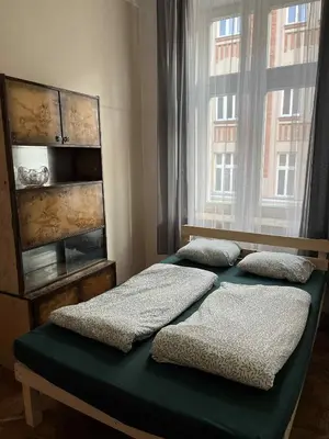 a bathroom with a toilet and a sink and a tub at Old Town Rooms Wielopole in Kraków
