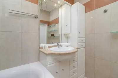 a bathroom with a sink and a shower at Spacious Retro Apartment in the Center of Cracow by Noclegi Renters in Kraków