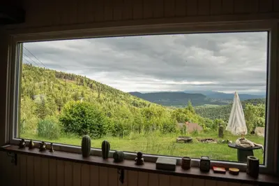 a window with a view of a mountain view at RESETówka nr 1 - chatka na odludziu z mega widokami & leśne SPA in Jaszczurowa