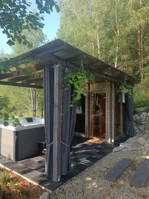 a gazebo with a tub in a garden at Mucharskie Stodoły Stodoła II - Garden Spa in Jaszczurowa