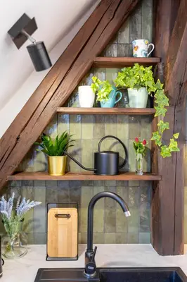 a room with a loft bed and a dining room with a table at Apartment with Entresol Old Town Krakow in Kraków