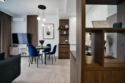 a kitchen and dining room with a table and chairs at Apartament Bliss 16 Zator by Housine in Zator
