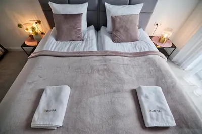 a bedroom with a bed with two pillows on it at Apartament Bliss 16 Zator by Housine in Zator