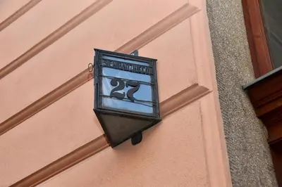 a street light on the side of a building at Kraków Family Nest in Kraków