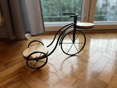 a bike with a wooden seat sitting on a floor at Apartament Globtroter in Kraków