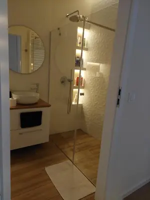a bathroom with a shower and a sink at Apartament Aktorów Bronowice in Kraków