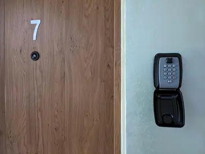 a remote control is attached to a door at Apartament Piccolo in Kraków