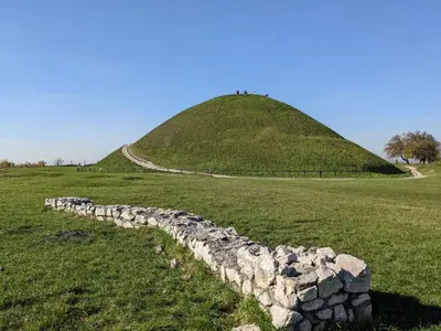a stone wall in front of a pyramid at Apartament Piccolo in Kraków