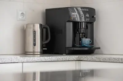 a coffee maker sitting on top of a counter at Cozy Apartment Bartla 19 by Noclegi Renters in Kraków