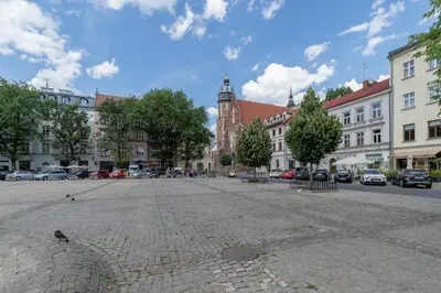 an empty street in a city with buildings at Sunny Studio Mostowa Krakow Kazimierz by Nolegi Renters in Kraków