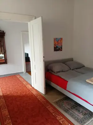 a small bedroom with a bed in a room at Plantyna in Kraków