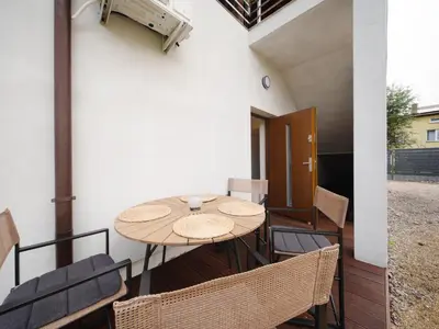 an outdoor patio with a table and chairs at Sweet Dreams Apartment in Zator
