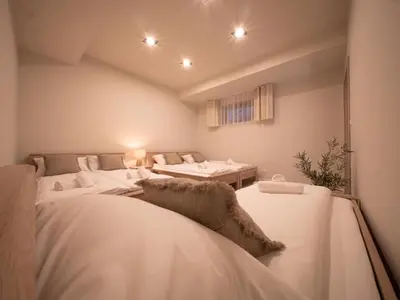 a room with two beds and a table at Sweet Dreams Apartment in Zator