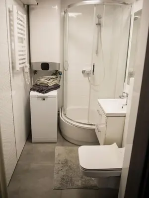 a bathroom with a shower and a toilet and a sink at Pod Wielorybem in Jaworzno