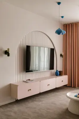 a living room with a tv on top of a dresser at Pops Apartment in Kraków