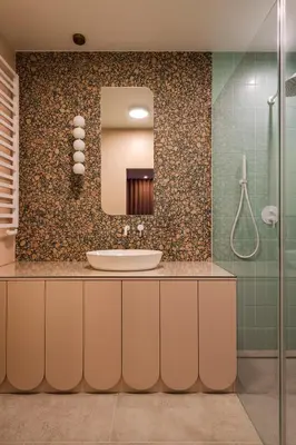 a bathroom with a sink and a mirror at Pops Apartment in Kraków