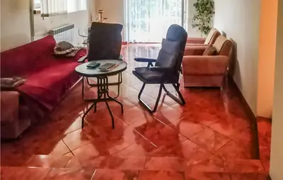 a living room with a couch and two chairs and a table at 3 Bedroom Awesome Apartment In Klucze in Klucze
