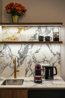 a kitchen counter with a sink and a phone on it at Old Town G6 by M Apartments in Kraków