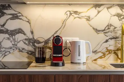a coffeemaker and a coffee maker on a counter at Old Town G6 by M Apartments in Kraków