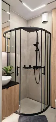 a glass shower in a bathroom with a sink at Magic House Apartament Proszowska 58 II in Bochnia