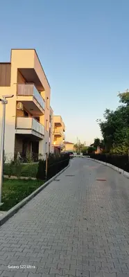 an empty street in front of a building at Magic House Apartament Proszowska 58 II in Bochnia