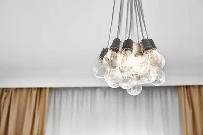 a chandelier hanging from a ceiling in a room at CityNest Apartments in Kraków