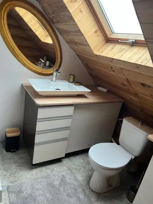 a bathroom with a sink and a mirror at Ranczo Borówka in Łapanów